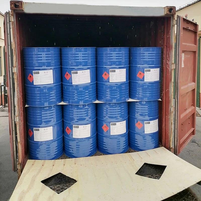 Industrial chemical drums, sacks, and containers in a warehouse